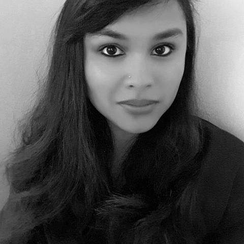 A black and white headshot of Dr. Ashley Caranto Morford.